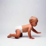 Infant in diaper crawling