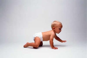 Infant in diaper crawling